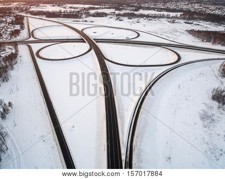 winter road junction in the countryside aerial view  in the form of butterfly