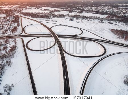winter road junction in the countryside aerial view  in the form of butterfly