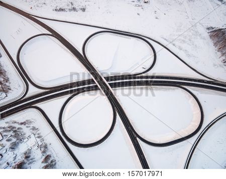 winter road junction in the countryside aerial view  in the form of butterfly