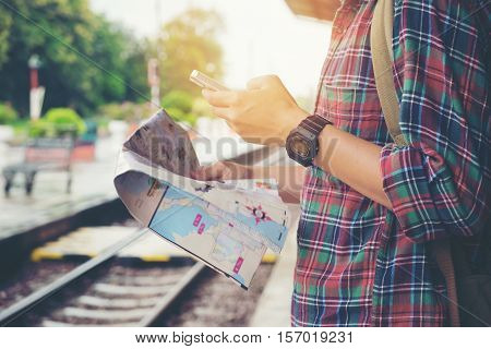 Young Tourist With A Beard Holding A Map Travel Concept