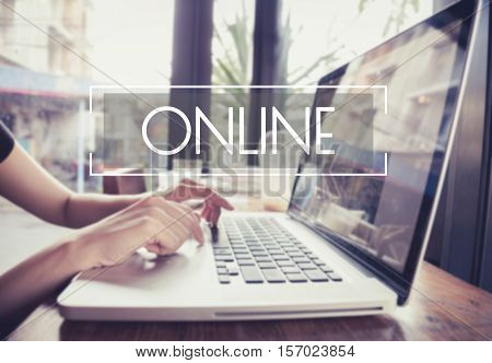business hand typing on a laptop keyboard with Online Internet homepage on the computer screen connection social networking technology concept.