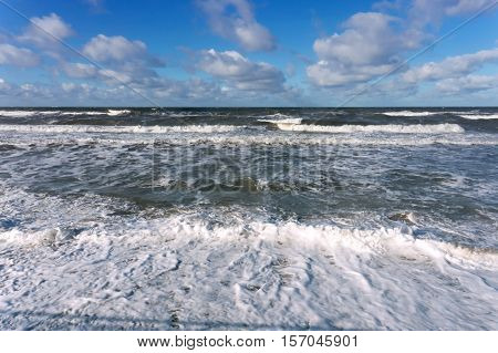 the waves of the sea Sunny day, beautiful clouds