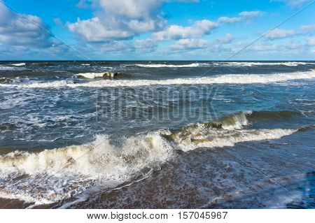 the waves of the sea Sunny day, beautiful clouds