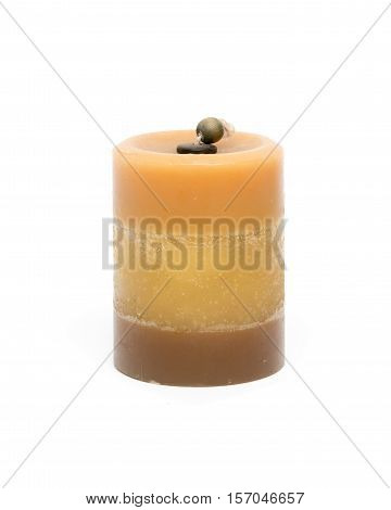 Orange wax candle isolated on white background