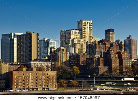 Manhattan skyline with brick buildings on sunny day
