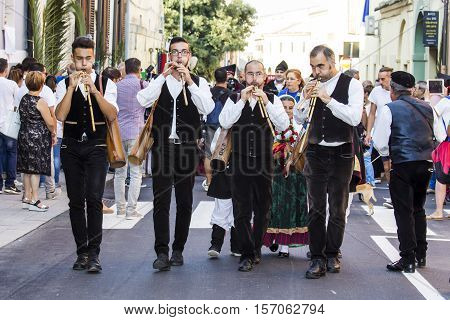 SELARGIUS, ITALY - September 11, 2016: Former marriage Selargino - Sardinia - group of launeddas musicians parading in traditional Sardinian costume