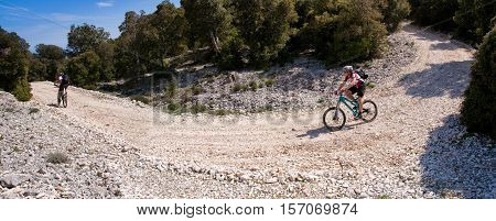 Sardinia on the paths between mountains and sea with the mountain bike trail to Cala Luna on background the sea