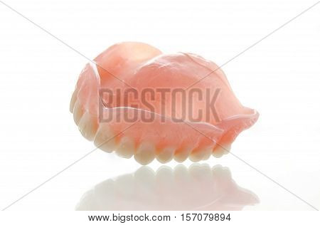 Photo of dental prosthesis upper on white background