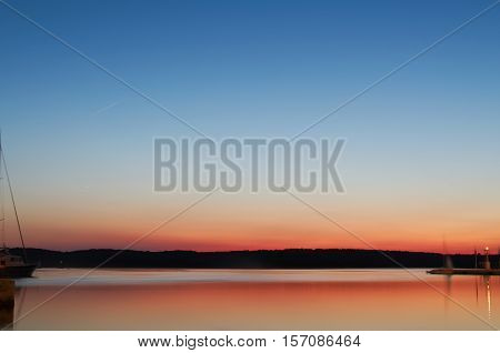 Orange Bay Seascape at Dusk with Clear Blue Sky