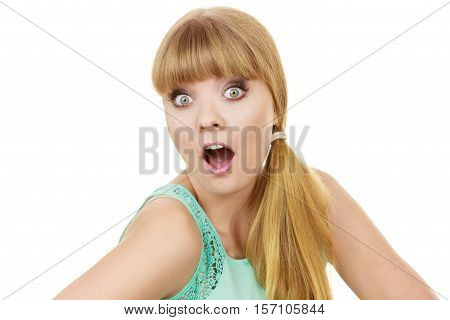 Concerned scared shocked woman. Emotional facial expression wide eyed girl surprised open mouth isolated on white