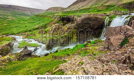 Water Cascade In The Mountains In Iceland