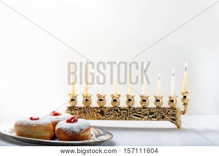 Sufganiyot and nine branched menora for Hanukkah