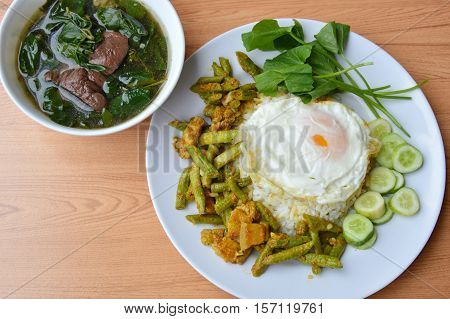 spicy stir fried yard long bean with fat pork curry topping egg and boiled pork blood soup