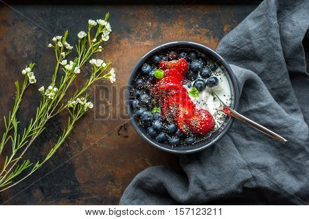 Greek yogurt with berries and hemp seeds. A healthy snack or meal.