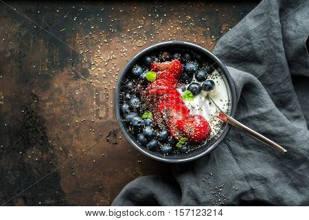 Greek yogurt with berries and hemp seeds. A healthy snack or meal.