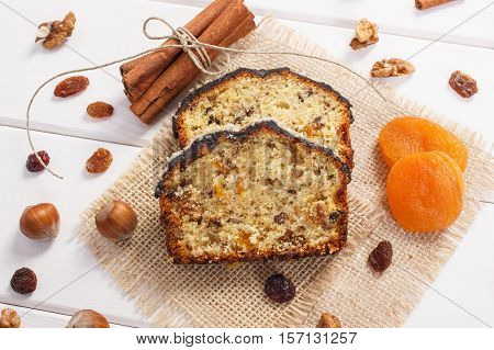 Fresh Baked Fruitcake With Ingredients On Boards