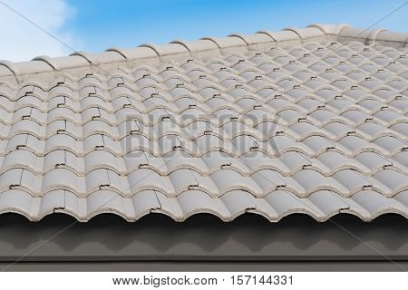 Rows of roof tiles on the top of house with sky background.
