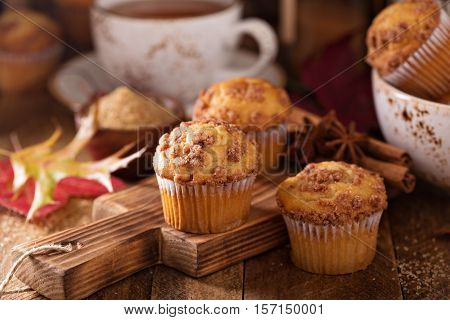 Seasonal cinnamon streusel muffins with tea in a rustic setting