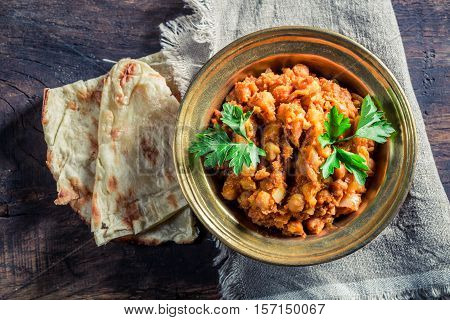 Indian Channa Masala With Chickpeas On Old Wooden Table