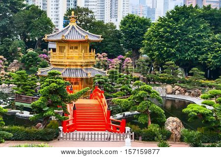 Traditional chinese house in public Nan Lian Garden, Hong Kong, China and bonsai trees panorama