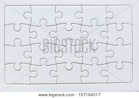 a complete puzzle of twenty white pieces