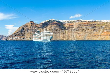 Santorini Greece - October 13 2012: View of Fira from the Caldera sea area voth a cruise ship in the foreground