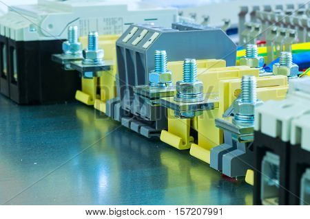 electrical terminals and circuit breakers on the mounting panel