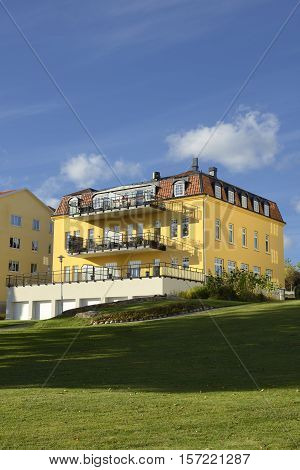 Nynashamn - a view of a colorful buildings on a public park. Nynashamn is located far south in Sodertorn, 58 kilometers south of Stockholm.