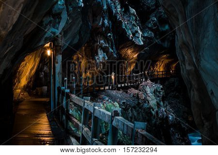Lit Passage Above River In Tamina Gorge
