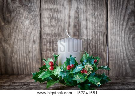 Christmas symbols including Candle on a wooden table