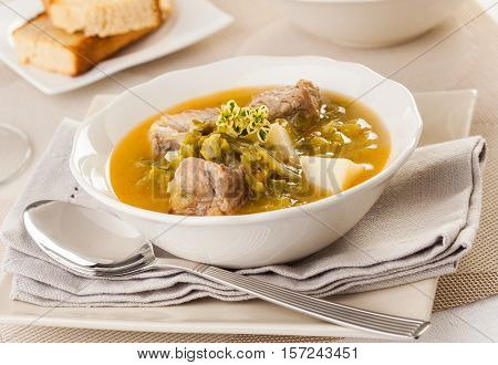 Traditional cabbage soup with beef served in a bowl
