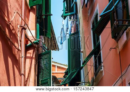picturesque scene of old houses with shuttered windows in Vernazza, Cinqueterre, Italy