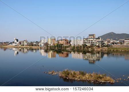 Rural city of Inuyama along the Kiso River in Aichi Perfecture Japan on a sunny Autumn morning