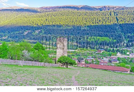 The mountain occupied with agriculture lands and the houses of the townlet located in valley Mestia Upper Svaneti Georgia.