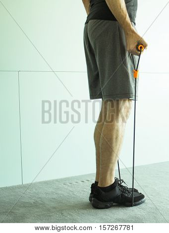 Man performing exercises with resistance rope fitness