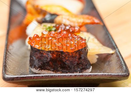 Japanese Sushi. Roll Made Of Smoked Fish And Roe.