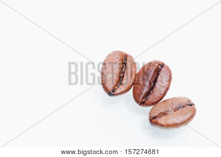 Macro coffee beans isolated on white background