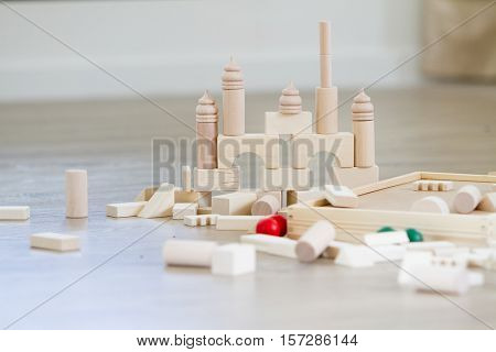 noname wooden bulding blocks, building castles and houses from wooden blocks at home
