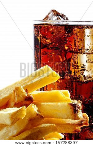 Cola with the ice in a glass and deep-fried potatoes