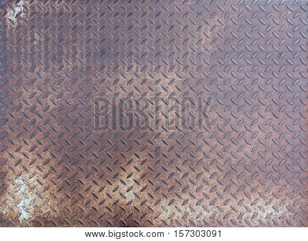 Used diamond rusty steel plate - grunge metal texture