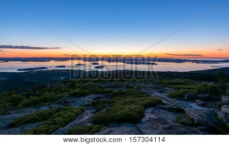 View from Cadillac mountain. Acadia National Park Maine. Sunrise. Bar Habor lights in the distance