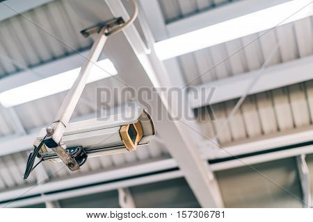 Surveillance security CCTV camera on the roof at night safety or security concept