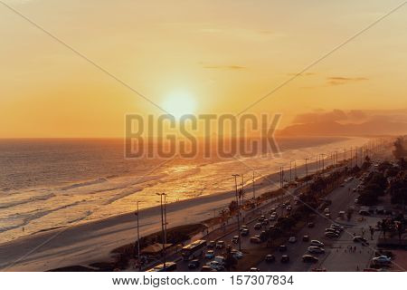 Top view of the ocean beach coastline road and far hills dramatic and colorful evening Rio de Janeiro Brazil