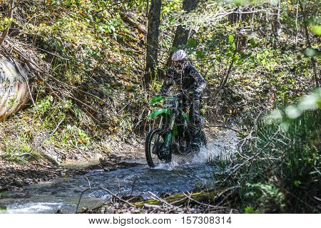 VLADIVOSTOK, RUSSIA - OCTOBER 10: competition On the edge 2016 Hard Enduro Rally with a KTM motorcycle. The hardest enduro rally in the world. October 10, 2016 in Vladivostok, Russia