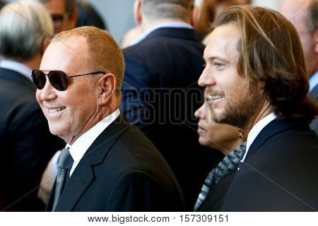NEW YORK-MAY 5: Michael Kors (L) and Lance LePere at the ribbon cutting ceremony for the Anna Wintour Costume Center Grand Opening at the Metropolitan Museum of Art on May 5, 2014 in New York City.