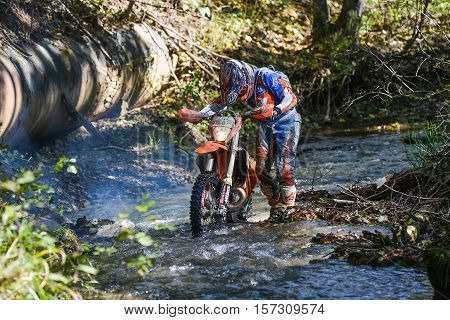 VLADIVOSTOK, RUSSIA - OCTOBER 10: competition On the edge 2016 Hard Enduro Rally with a KTM motorcycle. The hardest enduro rally in the world. October 10, 2016 in Vladivostok, Russia