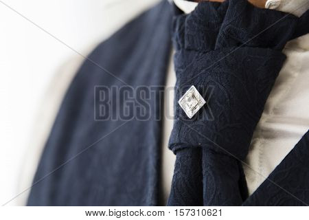 Close up view of a wedding tie with central jewel