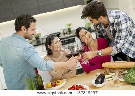 Young People Sitting By The Table