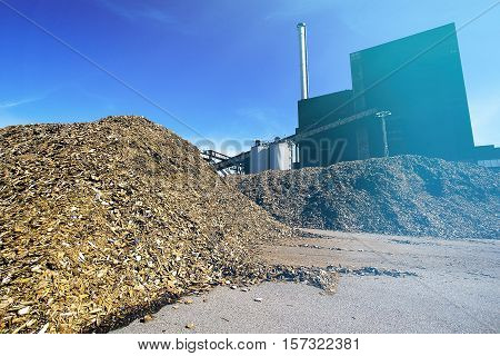 Bio Power Plant With Storage Of Wooden Fuel (biomass) Against Blue Sky