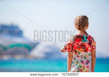 Adorable little girl at tropical beach on vacation